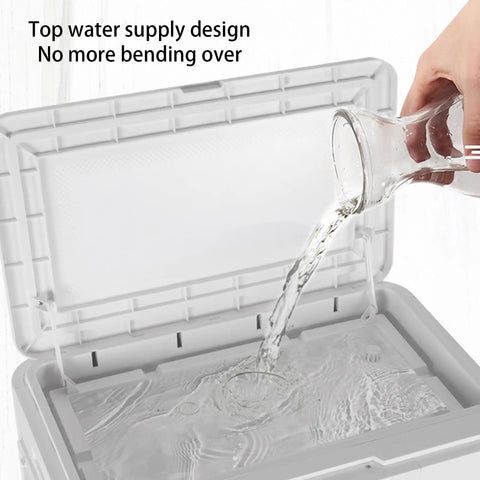 Pouring water into the top water supply of a portable evaporative cooler to maintain functionality.