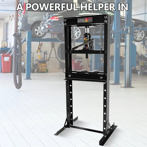 Heavy Duty 20 Ton H Frame Hydraulic Shop Press With Bearing Installation Kit And Adjustable Work Table For U Joint Repair in a workshop.