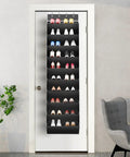 Over The Door Shoe Organizer Rack With Deep Pockets, 10 Tier Hanging Shoe Holder For Sneakers And Boots, Ultra Large Capacity Fits 20 To 30 Pairs, Door Mount Storage, Black, fully loaded with shoes, mounted on a white door in a modern room.