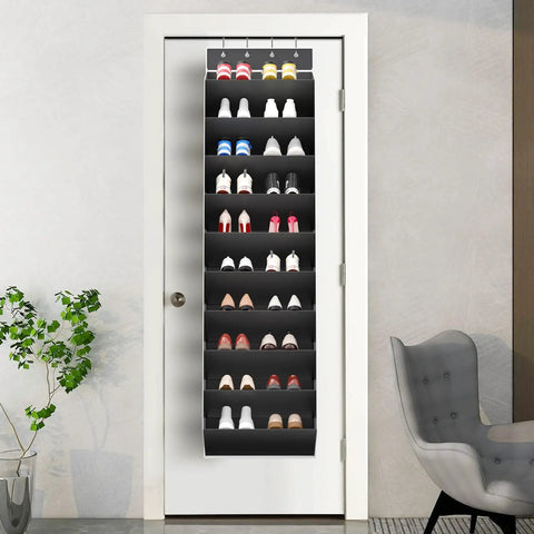 Over The Door Shoe Organizer Rack With Deep Pockets, 10 Tier Hanging Shoe Holder For Sneakers And Boots, Ultra Large Capacity Fits 20 To 30 Pairs, Door Mount Storage, Black, fully loaded with shoes, mounted on a white door in a modern room.