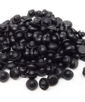 Pile of black Ridged SBR Rubber Push In Bumper One Half Inch Diameter Five Thirty Second Inch Height Fits One Quarter Inch Hole