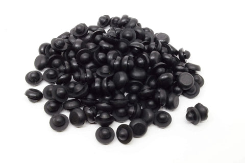 Pile of black Ridged SBR Rubber Push In Bumper One Half Inch Diameter Five Thirty Second Inch Height Fits One Quarter Inch Hole