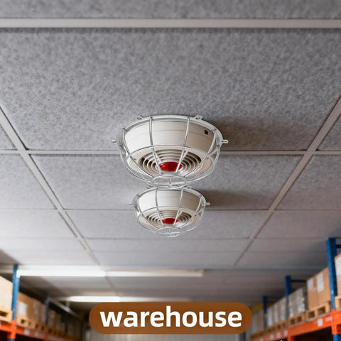Heavy Duty Metal Detector Guard Cover And Fire Alarm Protector With Tool Less Quick Mount For Sprinkler Heads And Smoke Sensors In Homes Offices Hotels Garages And Commercial Buildings Built Tough To Keep Things Secure installed on ceiling in a warehouse.