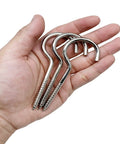 10 Pack Badass Nickel Plated Steel Screw Hooks Massive 4 Inch Shank With Giant 1.5 Inch Eye Swag showing in a hand.