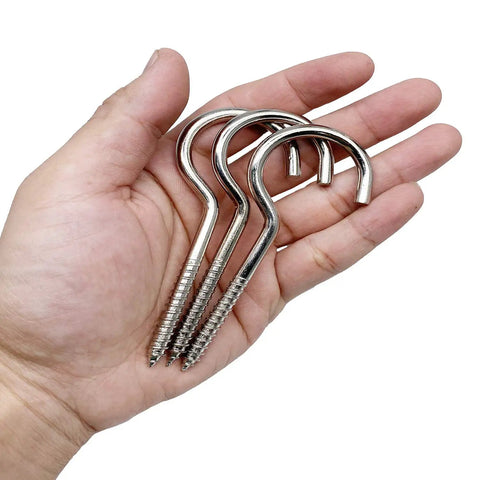 10 Pack Badass Nickel Plated Steel Screw Hooks Massive 4 Inch Shank With Giant 1.5 Inch Eye Swag showing in a hand.