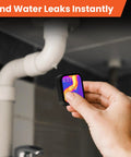 Hand using Pocket Sized Thermal Camera With Touchscreen No App Needed 80x60 Infrared Imager For Home Inspection Detect Hidden Cameras And Water Leaks Compact Handy Tool For Quick Leak Checks And Thermal Troubleshooting near a pipe.