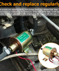 12V Inline Fuel Pump Low Pressure Transfer installed in engine bay with 8mm hose, suitable for motorcycles, lawn mowers, carburetors.