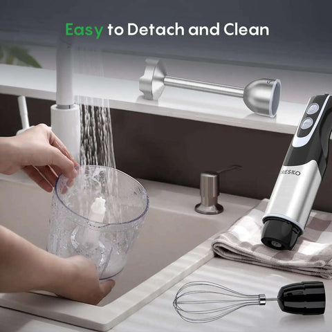 Pro Level 500W Immersion Hand Blender Kicked Up With 12 Variable Speed Settings Plus Turbo Boost Option And Reliable 4in 1 Kitchen Wand being cleaned with water.