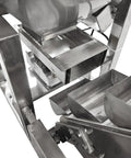Close-up view of the rugged 220V 1 phase bucket elevator material conveyor showing stainless steel construction and hoppers.