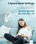 Dope 8 Inch Wall Mounted Fan With Remote, 90 Degree Oscillation, Four Speed Settings shown above woman sitting on couch