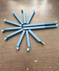 Top Shelf 11 Piece Tungsten Carbide Lathe Turning Tool Set With Heavy Duty Boring Bars and Roughing Grooving Inserts laid out on a wooden surface.