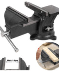 Heavy Duty Six Inch Bench Vise Rock Solid Cast Steel Frame With Double Locking Swivel Base And Flat Hammer Anvil Surface For Tough Daily Shop Grind Woodworking And Pipe Clamping Projects Black Finish, side view showing jaws with wood