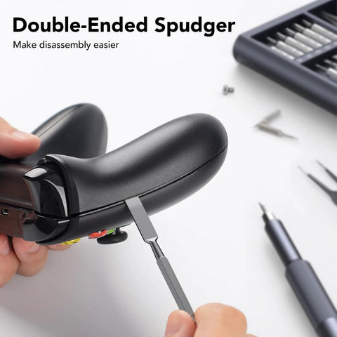 Using double-ended spudger on game controller with Grab And Go 50 In 1 Precision Screwdriver Set With Security Torx and Magnetic Kit