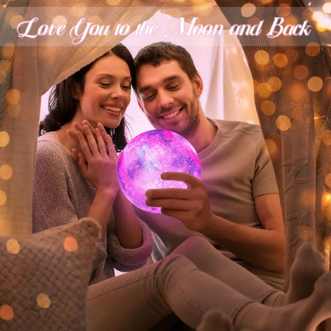 Couple admiring 7.1 Inch Galaxy Moon Lamp 3D Printed Moon With NASA Imagery, 16 Color Changes, in cozy room setting.
