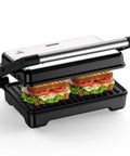 Yashe 1200W Panini Press Grill and Sandwich Maker With Nonstick Plates, two toasted subs inside nonstick grill.
