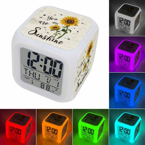 Totally Sweet Farm Sunflower Cube Digital Alarm Clock With Silent Sweep Snooze Function And Chill Nightlight colors showing time and date.