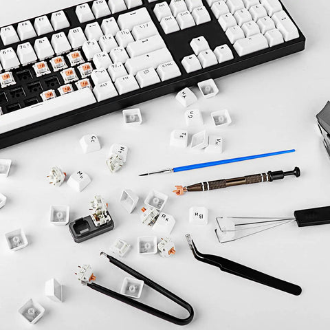 Aluminum Switch Opener And Lube Kit For Custom Keyboards With Tweezers And Four Claw Gripper All In One Keyboard Lube Tools for Cherry MX switches on a dismantled keyboard.