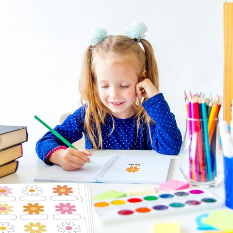 Girl in blue shirt using Retro Groovy Floral Name Tag Stickers with Daisy Flower Nameplates in a classroom setting.