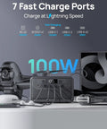 Portable Power Station 89.6Wh LiFePO4 Battery with Solar Ready 100W and USB C PD charging multiple devices on table