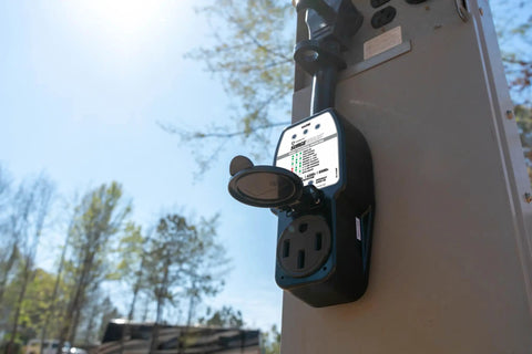 Portable RV Surge Protector 50 Amp For Pop Up Campers And Travel Trailers, Detects Faulty Park Power, mounted on outdoor panel