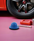 Heavy Duty Wire Brush Grinding Disc for polishing wheel hubs in car detailing, next to tools and a tire, designed for restoration.