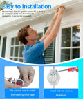 Man installing 32.8 Foot RGB LED Strip Lights With Music Sync For Bedroom Living Room And Parties on outdoor eaves with tape.