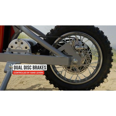 Close-up of MX500 Dirt Rocket Electric Ride On Bike For Teens Ages 14 And Up 36V Battery Top Speed 15 MPH 40 Minute Run Time Twist Grip Throttle Pneumatic Knobby Tires Heavy Duty Steel Frame Red showing rear wheel dual disc brakes and hand lever controls.