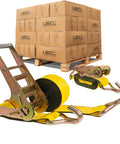 Built Tough As Nails 3 Inch Wide X 20 Feet Yellow Ratchet Straps With Wire Hook secured with pallets in the background.