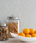 Close-up of Easy DIY Peel and Stick Glass Backsplash Tiles for Kitchen or Bathroom, Subway White 3x6 Inch Glass Tiles in use.