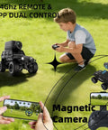 Child playing with One Sixty Four Scale 4WD Alloy Mini RC Crawler With FPV Camera, remote control and mobile app in view