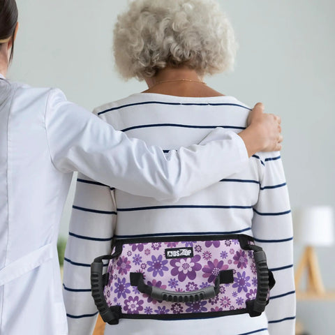 Anti Slip Gait Belt Transfer Strap For Seniors with floral pattern, shown on a patient assisted by a caregiver.