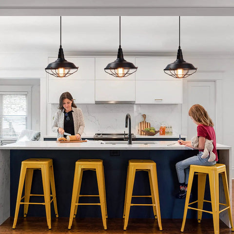 Black Pendant Light Set 3 Pack, Industrial Farmhouse Pendant Lighting over kitchen island with yellow stools and family.