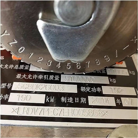 Close-up of Heavy Duty Semi-Automatic Industrial Stamping Printer Machine marking device showing engraved numbers on metal plate.