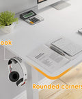 Electric Standing Desk With Four Memory Presets And No Sweat Height Adjustment In White, ergonomic table with rounded corners and headphone hook.