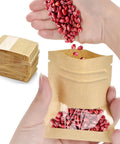 Hands filling 100 Pack Resealable Mini Kraft Bags With Window For Samples, Small Zip Lock Seed Envelopes with red beans