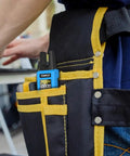 Digital Clamp Meter With U Shaped Jaw For AC And DC Current And Voltage in tool belt pocket, technician background