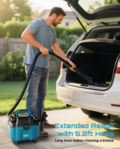Man using Cordless Wet And Dry Shop Vacuum For Garage And Car Cleanups Boss Grade 2.6 Gallon Mini Vacuum with long hose