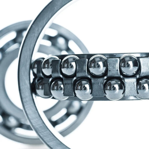 Close-up of Bulletproof Build Two Inch Chrome Steel Bearing Balls G25 Precision in bearing assembly for machinery use.
