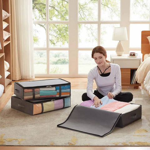 Under Bed Storage Bags 40L Set Of 3 With Front Clear Window foldable closet organizers displayed in a bedroom with colorful towels.