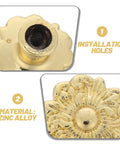 Close-up of antique zinc alloy drawer pull with floral pattern highlighting installation holes and material details.