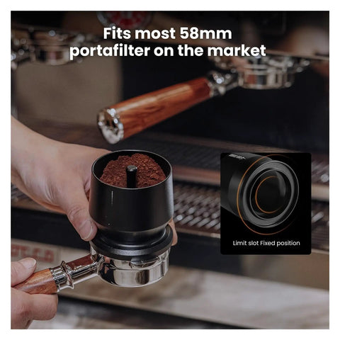 Three Piece Sleek Espresso Powder Receiver Cup And Dosing Funnel Fits 51 54 58Mm Portafilters with ground coffee in hand.