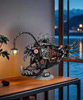 Angler Fish Mechanical Building Block Set With Lights Dope STEM Toy for Kids and Adults displayed on desk at night