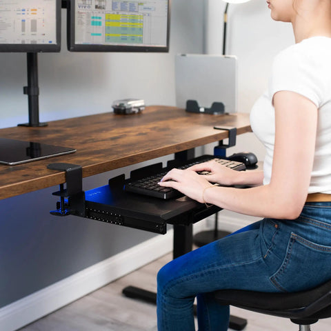 Under Desk Keyboard Tray With Pull Out Platform Extra Sturdy C Clamp Mount Big 33 Inch Wide By 11 Inch Deep Slide Out Tray Built In Pencil Drawer Space Saving Keyboard And Mouse Setup Black, person using at a desk
