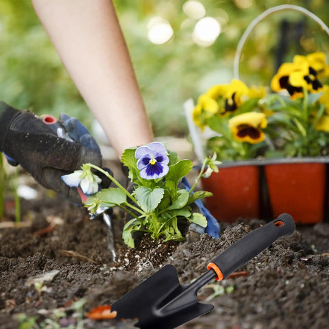 Heavy Duty Garden Trowel With Comfort Grip Oversized Aluminum Alloy Hand Shovel That Digs Through Rocky Soil Fast in use.