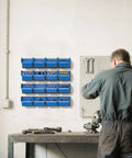 Wall Mounted Storage Bins Kit With 16 Plastic Bins And 4 Rails For Your Garage Tools Keeps Screws Nuts Bolts Nails And Small Hardware Sorted And Easy To Reach Heavy Duty Hanging Organizer System In Bright Blue installed in a workshop.