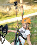 Child using Heavy Duty Zip Line Pulley Kit With Six Steel Rollers For Backyard Adventure, Easy Install, Supports Up To 440 Lbs