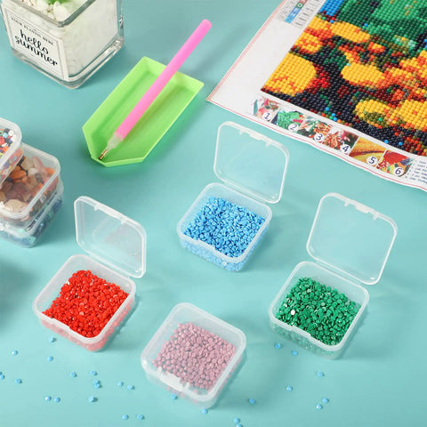 Six Piece Mini Clear Plastic Storage Containers Set with colorful beads on blue background