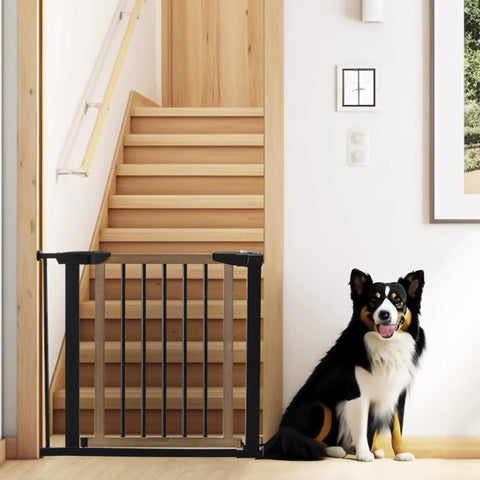 Rock Solid Wooden Dog Gate With Walk Through Swing For Indoor Puppy Protection And Pressure Mount Setup securing stairs with black and wood design.