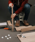 Assembling furniture using Clear Plastic Shelf Support Pegs Set Of 100 Self Locking Pins For Cabinet Shelves No Fuss Install