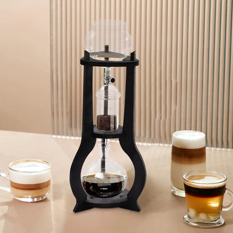Kick Back And Sip Smooth Chills With This Sharp Cold Brew Drip Coffee Maker Crafted From A Borosilicate Pitcher And Real Wood Stand For Hassle Free Iced Coffee Runs That Come Out Fresh And Totally On Point Daily, showing cold brew coffee maker with borosilicate glass and wooden stand.